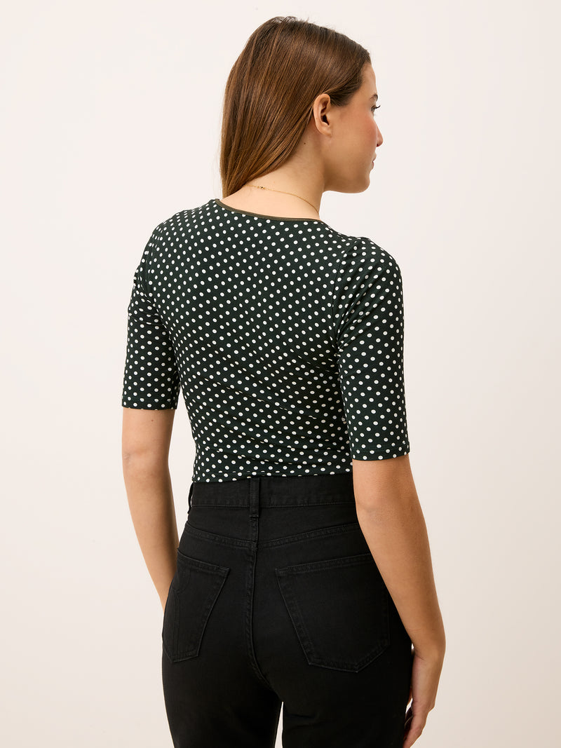 Green polka dot bodysuit, back view, worn by a model