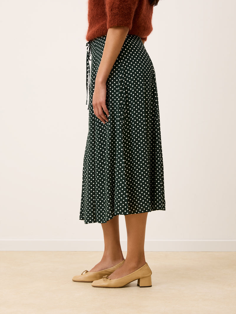 side view of Ilona polka dots midi skirt worn by a model