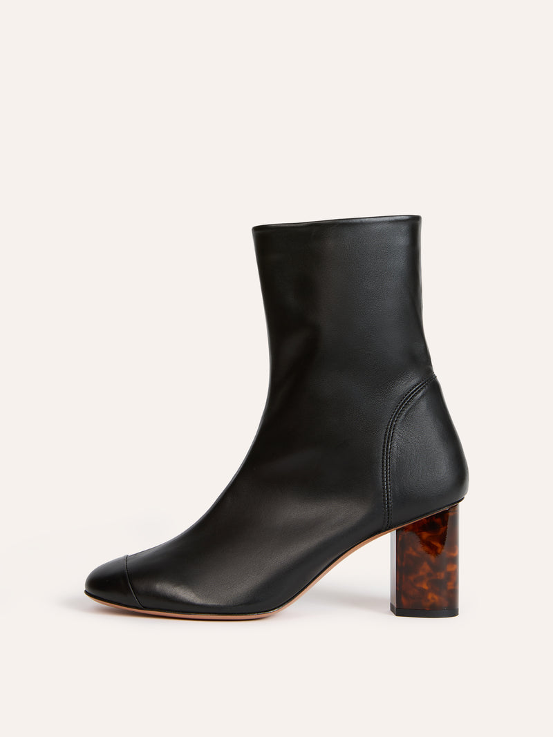 LOULA black leather ankle boots worn on a model by Rouje