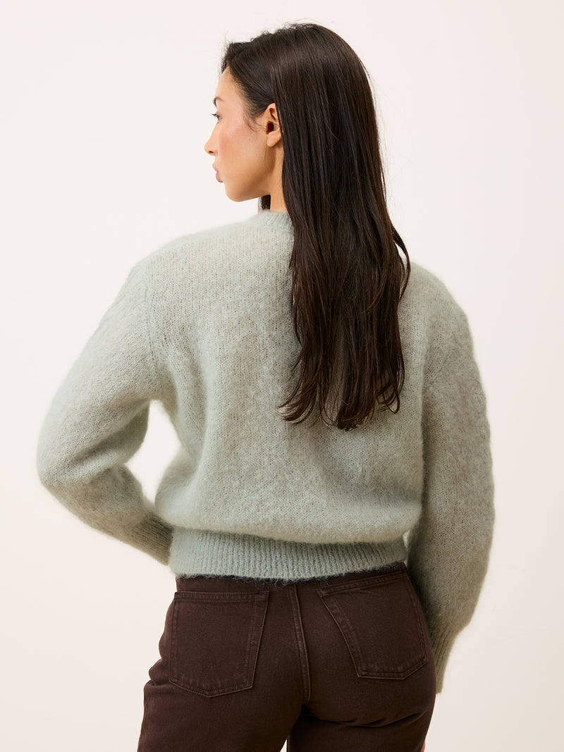 Maina cardigan in mint color worn, back view